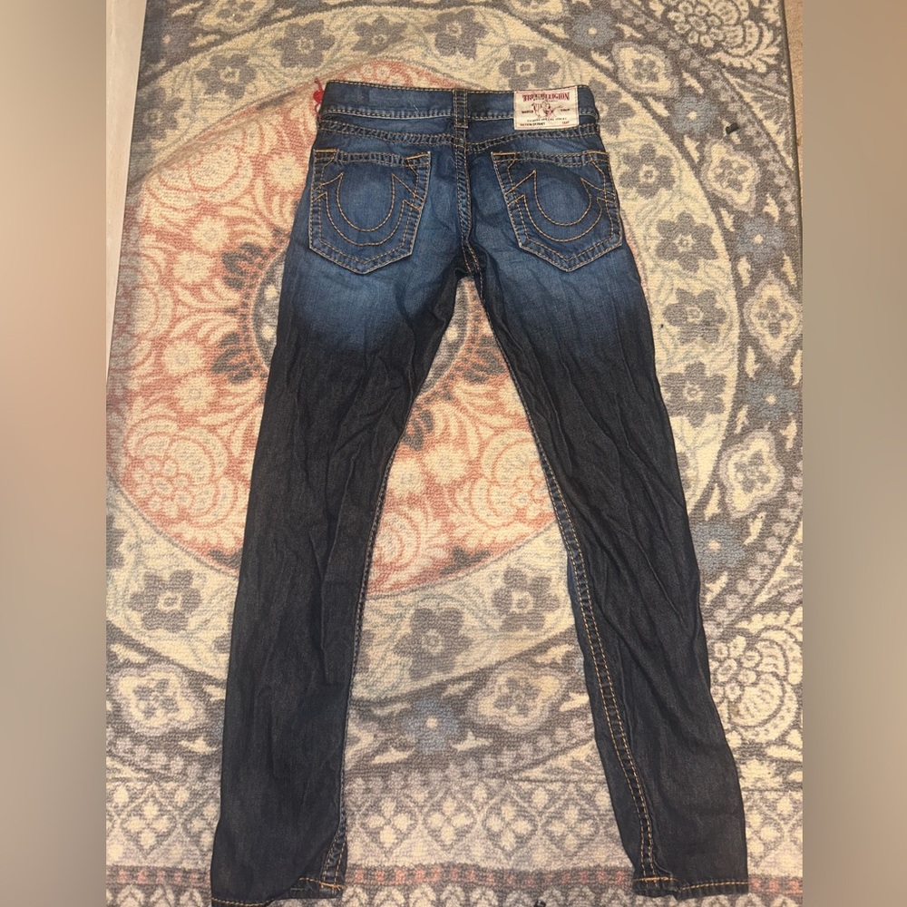 True religion skinny’s. Thick orange stitching and two tone denim.